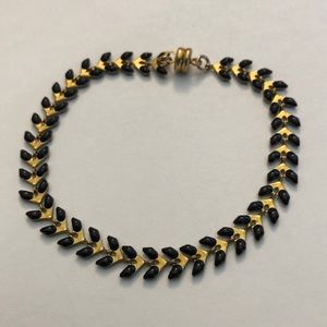 Gold tone and black enamel leaf bracelet.